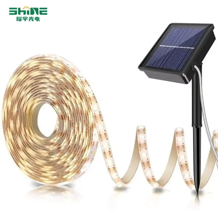 Solar String Lights with warm white LED strands and a black ground-insert solar panel, ideal for elegant and energy-efficient outdoor lighting.