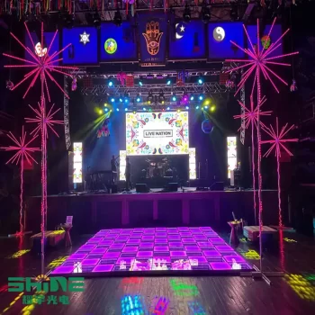 LED string lights for weddings in pink firework style illuminate a concert-style stage with a vibrant infinity dance floor, creating a festive and romantic ambiance.