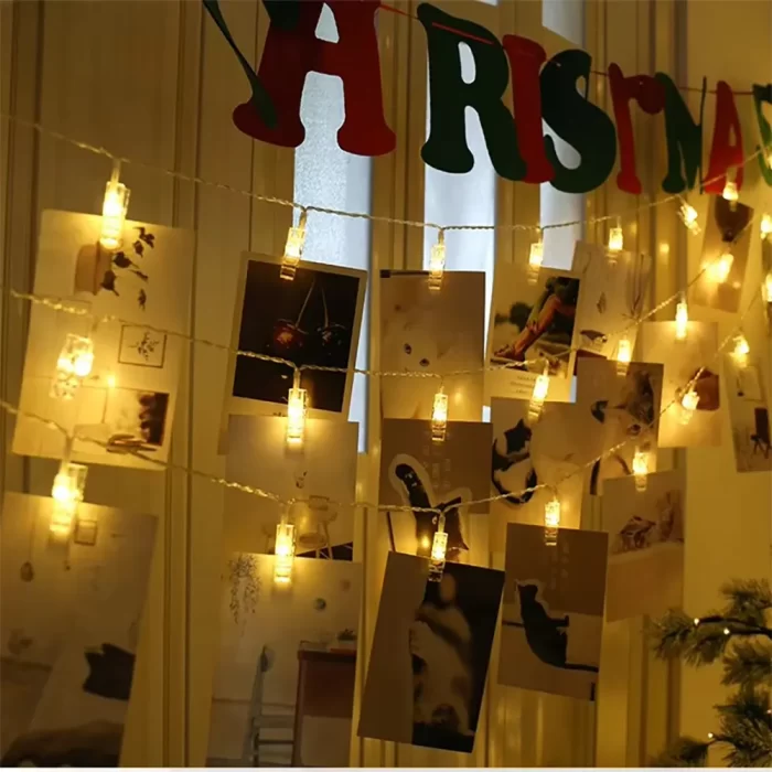 photo display lights softly glow on hanging polaroid photos, creating a warm and romantic bedroom vibe