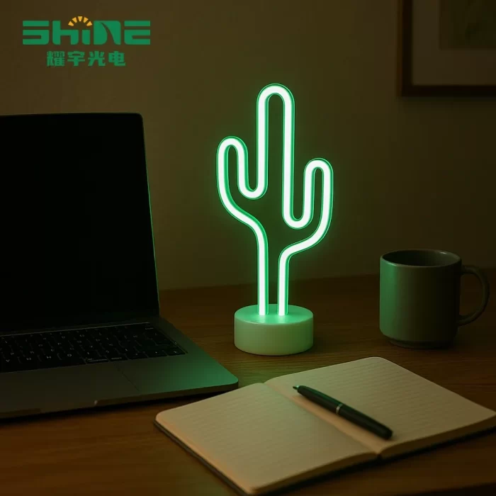 Tropical cactus desk light glowing on café table with coffee cup, glass and green plants