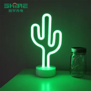 Green cactus neon light glowing on desk beside glass jar, eco-friendly PVC and LED strip design