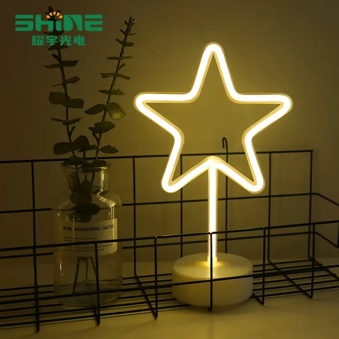 Star light LED decoration in warm white, modern table display for supermarkets, holiday aisles, and cafés.