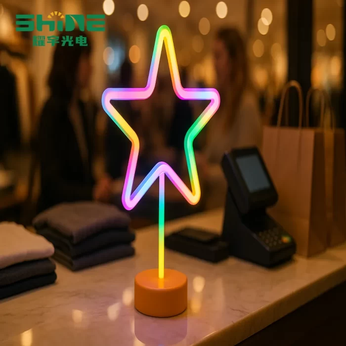 At a boutique checkout, a star mini neon light serves as neon light decor beside the POS