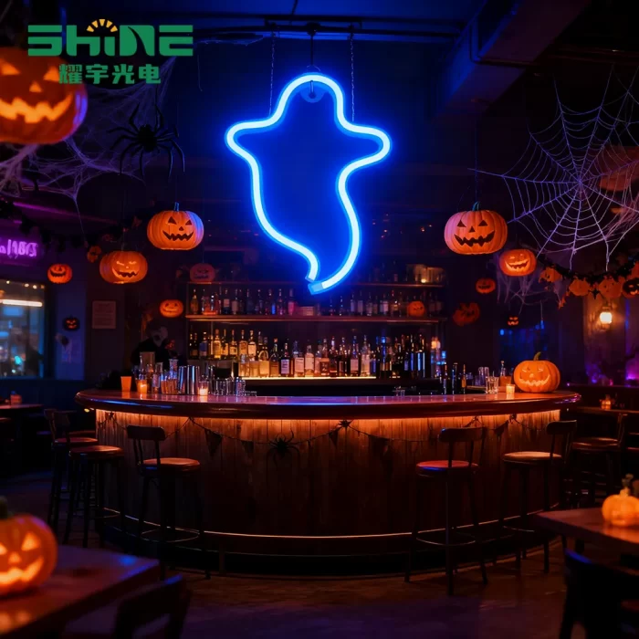 arge Halloween neon sign shaped like ghost organizes pub bar zone, helping customers navigate festive seating and drink sections.