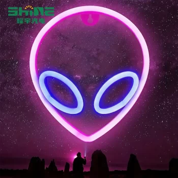 Pink and blue alien neon sign against galaxy background for sci-fi theme