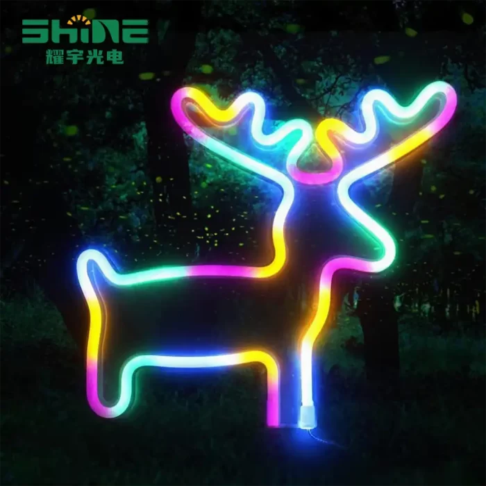 Outdoor deer neon sign, multi-colour glow in a dark woodland setting