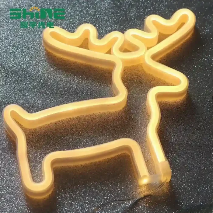 Yellow deer neon sign glowing warmly, ideal for holiday displays and seasonal retail décor.