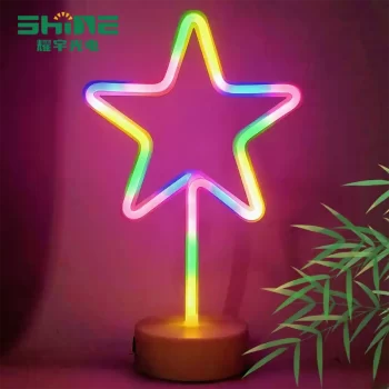 Multi-color star neon sign glowing indoors, decorative LED light for holiday displays and retail shops.