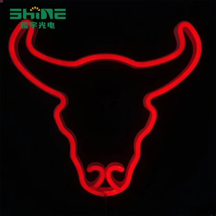 Red bull head neon light glowing on dark background, bold animal sign for bars and retail décor.