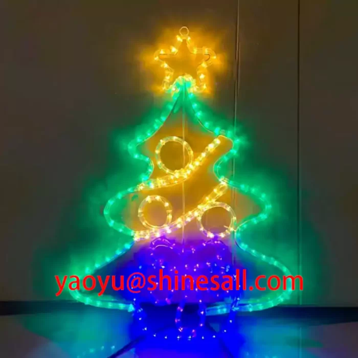 A colorful 2D Christmas tree motif light fully illuminated in green, yellow, and blue LEDs, showcasing the product's color consistency and vibrant display.
