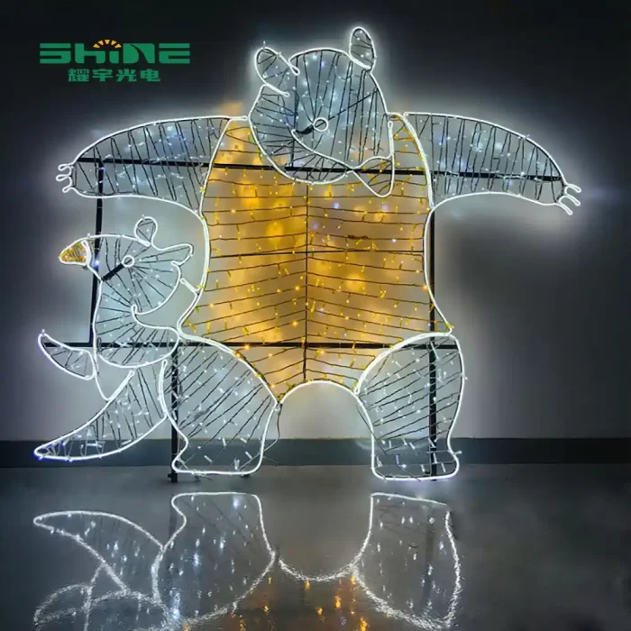A large, white and gold IP65 bear 2D motif light, showcasing robust 2D motif lights manufacture and perfect for commercial outdoor scenes.