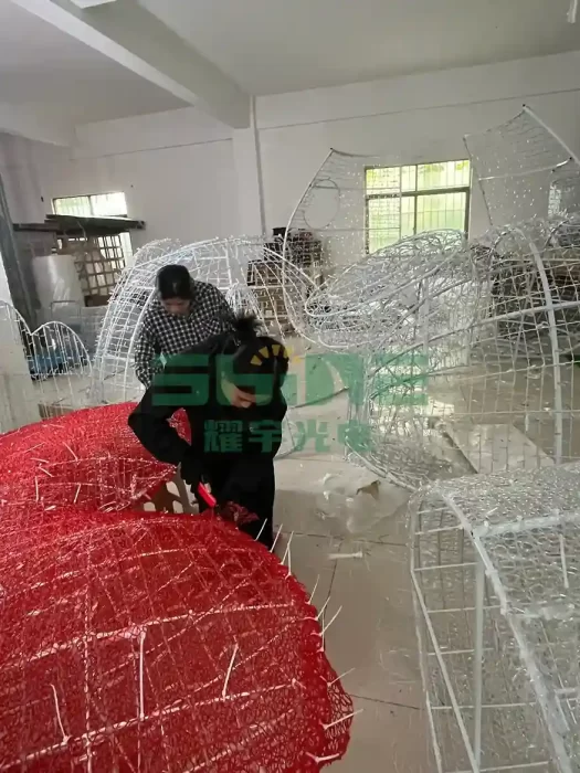 Manufacturing process of wholesale 2D motif lights in a clean factory setting.