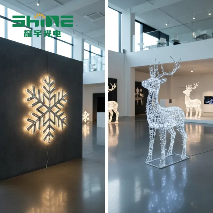 A side-by-side comparison of motif lights in a bright showroom: on the left, a 2D snowflake motif light with warm backlighting is mounted on a grey wall; on the right, a free-standing 3D reindeer light sculpture with cool white LEDs stands on the polished floor.