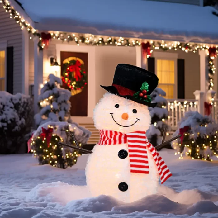 A glowing 3D snowman motif light with a top hat and red striped scarf displayed in a snowy front yard, illustrating the immersive, sculptural effect of custom 3D light installations.