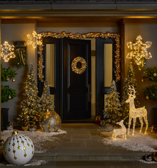 LED snowflake and reindeer motif lights creating an instant focal point at a front porch Christmas display