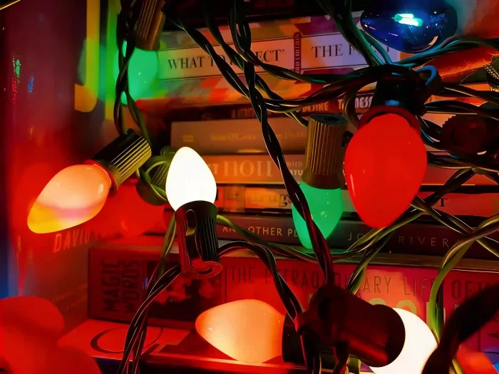 Red, green, and white C9-style bulb string lights on a shelf