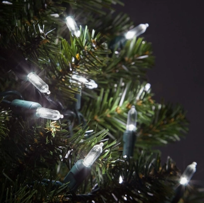 Cool white mini LED string lights on a Christmas tree branch