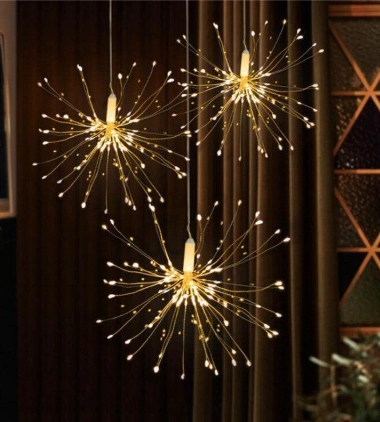 Indoor hanging LED firework lights in warm white starburst design for wedding reception decor