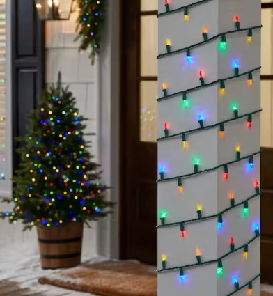 Multicolor LED mini string lights wrapped on a porch column beside a small lit Christmas tree