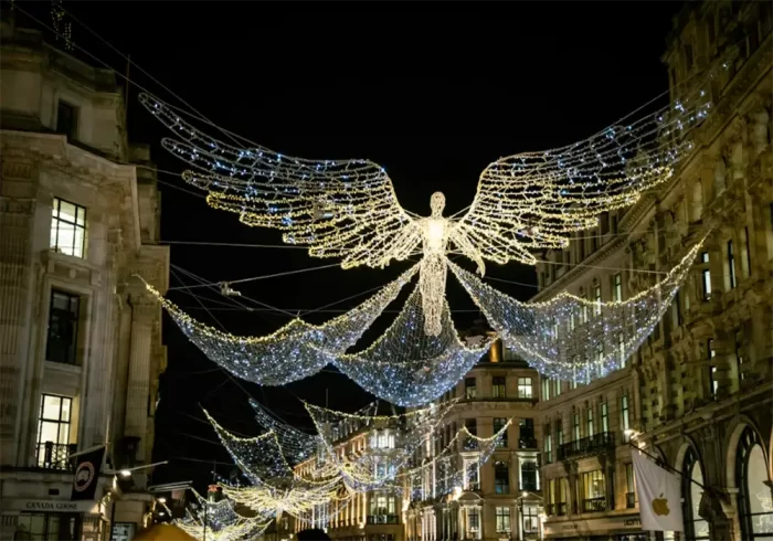 LED angel christmas light motifs spanning a street for religious holiday displays