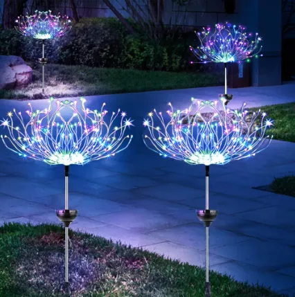 Firework solar lights installed along a garden pathway with colorful LED starburst effects